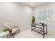Home office featuring modern desk, chair, accent chair, area rug, and wall art at 716 Manns Harbor Dr, Apollo Beach, FL 33572
