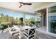 Enjoy this covered outdoor patio surrounded by lush landscape and offering natural light at 716 Manns Harbor Dr, Apollo Beach, FL 33572
