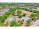 Aerial view of community amenities including a park, basketball court, and lush greenery at 7207 Forest Mere Dr, Riverview, FL 33578