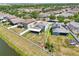 Aerial view showcasing the home, large fenced yard, screened-in patio, and neighborhood at 7207 Forest Mere Dr, Riverview, FL 33578