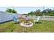 Charming backyard fire pit area with comfortable seating for outdoor gatherings at 7207 Forest Mere Dr, Riverview, FL 33578