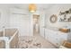 Bright Bedroom featuring white furnishings, modern decor, neutral tones, and soft carpeting at 7207 Forest Mere Dr, Riverview, FL 33578