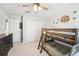 ' bedroom featuring bunk beds, a ceiling fan, and neutral carpeting at 7207 Forest Mere Dr, Riverview, FL 33578