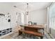Airy dining area with a wooden table, bench, and stylish decor at 7207 Forest Mere Dr, Riverview, FL 33578