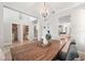 Open dining space offers a rustic wooden table, bench seating, and views of the home at 7207 Forest Mere Dr, Riverview, FL 33578