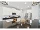Bright kitchen with granite countertops, stainless steel appliances, and white cabinets at 7207 Forest Mere Dr, Riverview, FL 33578