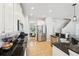 Spacious kitchen with stainless steel appliances, granite counters, and open view to the breakfast nook and staircase at 7207 Forest Mere Dr, Riverview, FL 33578