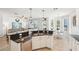 Modern kitchen with granite countertops, stainless steel appliances, and an open view into the adjacent living spaces at 7207 Forest Mere Dr, Riverview, FL 33578