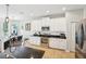 Well-equipped kitchen with granite countertops, stainless steel appliances, and white cabinets at 7207 Forest Mere Dr, Riverview, FL 33578