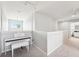 Bright loft area features a piano and neutral carpet, offering a versatile space at 7207 Forest Mere Dr, Riverview, FL 33578