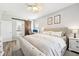 Bright bedroom features wood floors, ceiling fan, desk and en suite bathroom with sliding barn door at 7207 Forest Mere Dr, Riverview, FL 33578