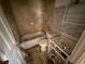 Bathroom with tiled shower, toilet, sink, and outdated flooring needs renovation at 7365 Royal Palm Dr, New Port Richey, FL 34652