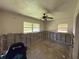 A bedroom with two windows, offering natural light and a serene atmosphere for relaxation and rest at 7365 Royal Palm Dr, New Port Richey, FL 34652