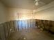 Unfinished bedroom with exposed wall studs, built-in shelving and natural light at 7365 Royal Palm Dr, New Port Richey, FL 34652