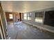 Spacious living room renovation project with multiple windows and exposed walls at 7365 Royal Palm Dr, New Port Richey, FL 34652
