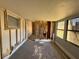 Living room with walls open and exposed and large windows for natural light at 7365 Royal Palm Dr, New Port Richey, FL 34652