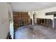 Spacious living room with exposed framework, ready for renovations to create a custom living space at 7365 Royal Palm Dr, New Port Richey, FL 34652