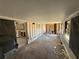 Large living room with exposed studs, windows and view into the kitchen at 7365 Royal Palm Dr, New Port Richey, FL 34652