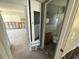 View into needing repair bathroom with a toilet and sink next to room needing repair at 7366 Royal Palm Dr, New Port Richey, FL 34652