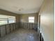 Bedroom awaiting restoration with natural light, offering potential for a personalized design at 7366 Royal Palm Dr, New Port Richey, FL 34652