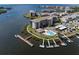 Aerial view of waterfront condos, docks, and beautiful blue water at 8141 Aquila St # 342, Port Richey, FL 34668