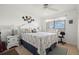 Charming bedroom with coastal decor, ceiling fan, and bright window overlooking the water at 8141 Aquila St # 342, Port Richey, FL 34668