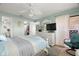 Bright bedroom with coastal decor, ceiling fan, and sliding glass doors to the outdoors at 8141 Aquila St # 342, Port Richey, FL 34668