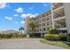 The building's exterior features private balconies and lush landscaping at 8141 Aquila St # 342, Port Richey, FL 34668