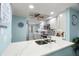 Bright kitchen features white cabinets, stainless appliances, modern fixtures and marble countertops at 8141 Aquila St # 342, Port Richey, FL 34668