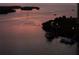 Scenic water view at sunset featuring a calm harbor, boats, and colorful sky at 8141 Aquila St # 342, Port Richey, FL 34668