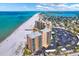 High-angle aerial view showcases the condo and the nearby beach, capturing coastal living at 880 Mandalay Ave # N710, Clearwater Beach, FL 33767