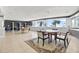 Shared lobby space with tables, chairs, and an ocean view at 880 Mandalay Ave # N710, Clearwater Beach, FL 33767