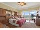 Comfortable main bedroom with tile flooring, balcony, and natural light at 880 Mandalay Ave # N710, Clearwater Beach, FL 33767