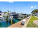 Image features a boat dock with multiple boat lifts, highlighting waterfront living and convenience at 0 Beach Se Dr # 162Ss, St Petersburg, FL 33705