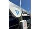 Close up of DECO boat lift with DEBRYLO MARINE label and blue and white boat at 0 Beach Se Dr # 162Ss, St Petersburg, FL 33705