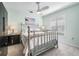 Serene bedroom with a metal bed frame, neutral decor, and plantation shutters at 10510 Castleford Way, Tampa, FL 33626
