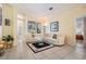 Bright living room features comfortable seating and seamless access to the outdoor pool area at 10510 Castleford Way, Tampa, FL 33626