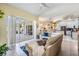 Open-concept living area with access to the kitchen, pool and patio at 10510 Castleford Way, Tampa, FL 33626