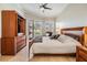 Serene bedroom with sliding glass doors to pool area, stylish furniture, and plenty of natural light at 10510 Castleford Way, Tampa, FL 33626