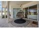 Cozy covered patio with a hanging chair, offering a tranquil outdoor living space at 10510 Castleford Way, Tampa, FL 33626