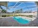 Inviting screened-in pool area with brick patio, perfect for relaxation and outdoor enjoyment at 10510 Castleford Way, Tampa, FL 33626
