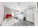 Bedroom features wood-look floors, pink accents, and a desk area for studying at 11208 Leland Groves Dr, Riverview, FL 33579