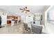 Open dining area with stylish furnishings, leading into the kitchen and other living spaces at 11208 Leland Groves Dr, Riverview, FL 33579