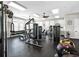 Well-equipped gym with a variety of exercise machines, weights, and ample natural light from large windows at 11208 Leland Groves Dr, Riverview, FL 33579