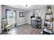 Bright home office featuring hardwood floors, lots of natural light, and space for multiple monitors at 11208 Leland Groves Dr, Riverview, FL 33579