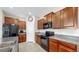 Modern kitchen with stainless steel appliances, granite countertops, and ample cabinet space at 11208 Leland Groves Dr, Riverview, FL 33579