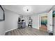 This home office features grey floors, neutral walls, and is located near the bathroom at 11208 Leland Groves Dr, Riverview, FL 33579