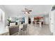Bright open concept layout featuring dining area, kitchen with island, and living room space at 11208 Leland Groves Dr, Riverview, FL 33579