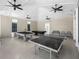 Spacious recreation room featuring a ping pong table and pool tables for entertainment at 11208 Leland Groves Dr, Riverview, FL 33579
