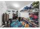 Walk-in closet with shelving, clothes racks, and plenty of storage space, great for organization at 11208 Leland Groves Dr, Riverview, FL 33579